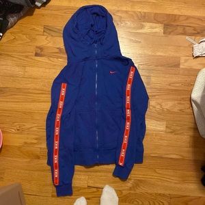size small Nike jacket, blue and red on sleeves